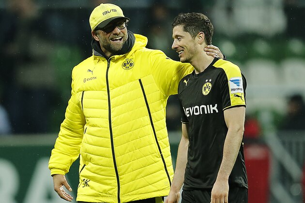 Dortmund head coach Juergen Klopp, left, and Dortmund's Robert Lewandowski of Poland are all smile after winning  the German first division Bundesliga soccer match between Werder Bremen and Borussia Dortmund in Bremen, Germany, Saturday, Feb. 8, 2014. (AP Photo/Frank Augstein)