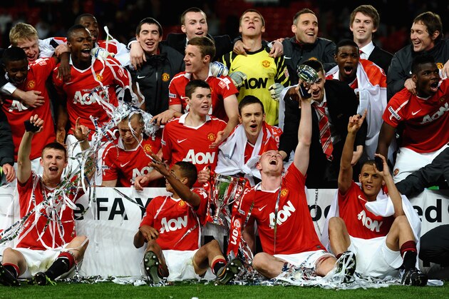 MANCHESTER, ENGLAND - MAY 23:  The Manchester United Team celebrate victory in the FA Youth Cup Final 2nd Leg match between Manchester United and Sheffield United at Old Trafford on May 23, 2011 in Manchester, England.  (Photo by Laurence Griffiths/Getty Images)