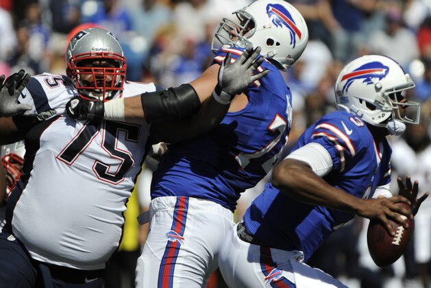 Buffalo Bills quarterback EJ Manuel (3) scrambles away from New England Patriots' Vince Wilfork (75) during the first half of an NFL football game Sunday, Sept. 8, 2013, in Orchard Park. (AP Photo/Gary Wiepert)