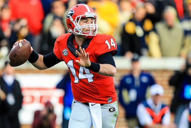Nov 30, 2013; Atlanta, GA, USA; Georgia Bulldogs quarterback Hutson Mason (14) rolls out on a  pass play in the first half against the Georgia Tech Yellow Jackets at Bobby Dodd Stadium. Mandatory Credit: Daniel Shirey-USA TODAY Sports