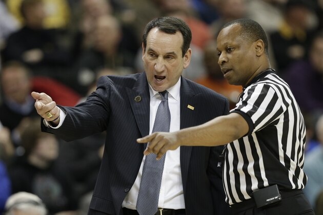 Duke head coach Mike Krzyzewski, left, argues a call with a referee during the first half of an NCAA college basketball game against Wake Forest in Winston-Salem, N.C., Wednesday, March 5, 2014. (AP Photo/Chuck Burton)