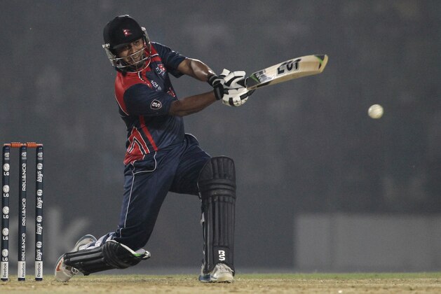 Nepal’s Gyanendra Malla plays a shot during a warm-up cricket match against Ireland ahead of the Twenty20 World Cup Cricket in Fatullah, near Dhaka, Bangladesh, Wednesday, March 12, 2014. (AP Photo/A.M. Ahad)