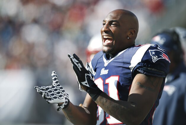 New England Patriots cornerback Aqib Talib claps hands on the bench in the second half of an NFL football game against the Tampa Bay Buccaneers Sunday, Sept. 22, 2013, in Foxborough, Mass. (AP Photo/Elise Amendola)