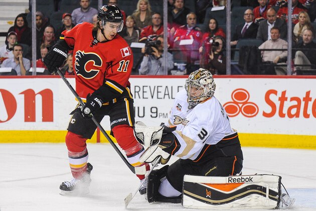 CALGARY, AB - MARCH 12: The shot of Mikael Backlund #11 of the Calgary Flames is stopped by Frederik Andersen #31 of the Anaheim Ducks during an NHL game at Scotiabank Saddledome on March 12, 2014 in Calgary, Alberta, Canada. The Flames defeated the Ducks 7-2.  (Photo by Derek Leung/Getty Images)