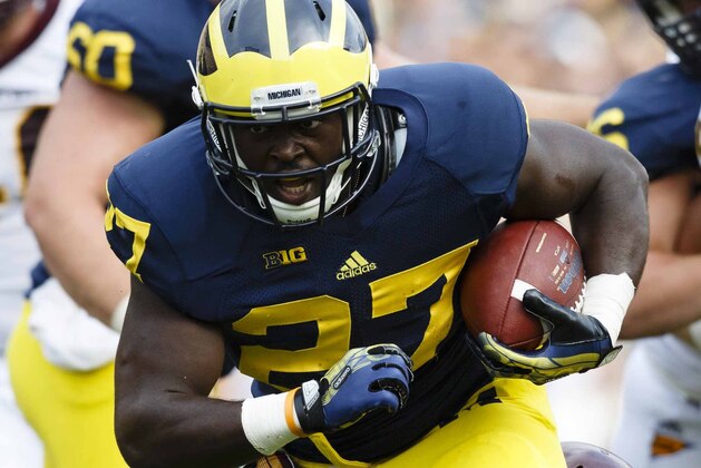 Aug 31, 2013; Ann Arbor, MI, USA; Michigan Wolverines running back Derrick Green (27) rushes with the ball in third quarter against the Central Michigan Chippewas at Michigan Stadium. Mandatory Credit: Rick Osentoski-USA TODAY Sports