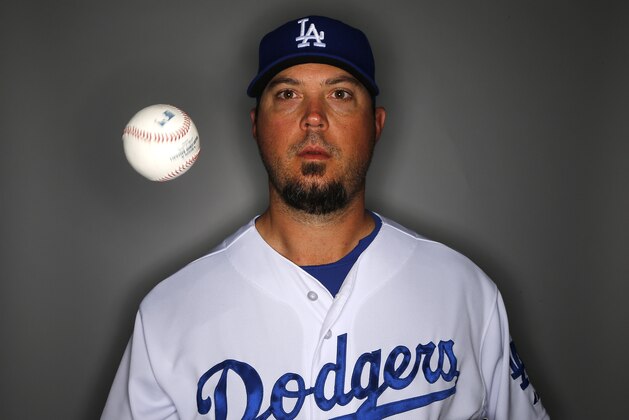 Los Angeles Dodgers pitcher Josh Beckett poses for a photograph on photo day Feb. 20, 2014 in Glendale, Ariz. (AP Photo/Paul Sancya)