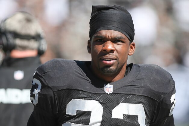 Sep 15, 2013; Oakland, CA, USA; Oakland Raiders cornerback Tracy Porter (23) on the sideline against the Jacksonville Jaguars during the second quarter at O.co Coliseum. Mandatory Credit: Kelley L Cox-USA TODAY Sports Sep 15, 2013; Oakland, CA, USA; Oakland Raiders cornerback Tracy Porter (23) on the sideline against the Jacksonville Jaguars during the second quarter at O.co Coliseum. Mandatory Credit: Kelley L Cox-USA TODAY Sports