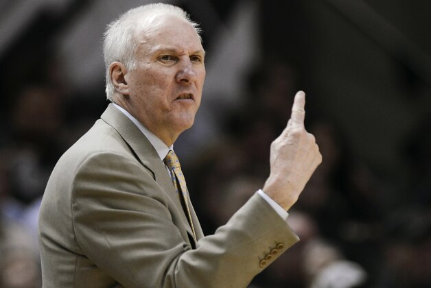 San Antonio Spurs hcoach Gregg Popovich yells to his players during the second half of an NBA basketball game against the Sacramento Kings on Saturday, Feb. 1, 2014, in San Antonio. San Antonio won 95-93. (AP Photo/Darren Abate)