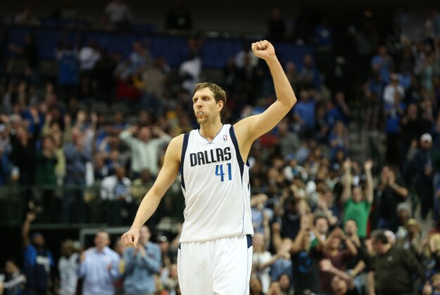 Mar 9, 2014; Dallas, TX, USA; Dallas Mavericks forward Dirk Nowitzki (41) celebrates late in the fourth quarter after his team made a three point basket against the Indiana Pacers at American Airlines Center. The Mavs beat the Pacers 105-94. Mandatory Credit: Matthew Emmons-USA TODAY Sports