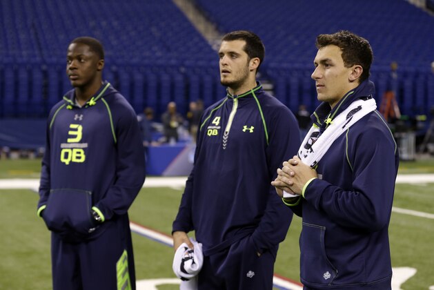 Texas A&M quarterback Johnny Manziel, right, Fresno State quarterback Derek Carr, center, and Louisville quarterback Teddy Bridgewater watch drills at the NFL football scouting combine in Indianapolis, Sunday, Feb. 23, 2014. (AP Photo/Michael Conroy) Texas A&M quarterback Johnny Manziel, right, Fresno State quarterback Derek Carr, center, and Louisville quarterback Teddy Bridgewater watch drills at the NFL football scouting combine in Indianapolis, Sunday, Feb. 23, 2014. (AP Photo/Michael Conroy)