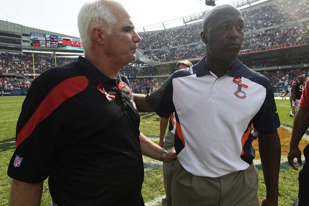 Chicago Bears head coach Lovie Smith, right, shakes hands with Atlanta Falcons head coach Mike Smith after their NFL football game in Chicago, Sunday, Sept. 11, 2011. The Bears won 30-12. (AP Photo/Nam Y. Huh)