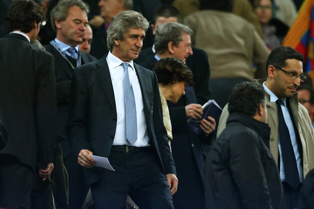 BARCELONA, SPAIN - MARCH 12:  Manuel Pellegrini the Manchester City manager watches from the stands due to a two match touchline ban during the UEFA Champions League Round of 16, second leg match between FC Barcelona and Manchester City  at Camp Nou on March 12, 2014 in Barcelona, Spain.  (Photo by Alex Livesey/Getty Images)