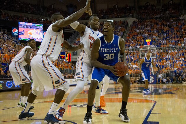 GAINESVILLE, FL - MARCH 08: Julius Randle #30 of the Kentucky Wildcats is defended by Will Yeguete #15 and Patric Young #4 of the Florida Gators during the second half of the game at the Stephen C. O'Connell Center on March 8, 2014 in Gainesville, Florida. (Photo by Rob Foldy/Getty Images)