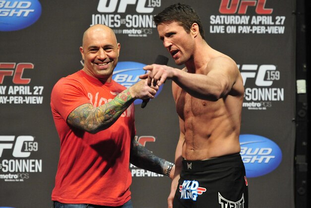Apr 26, 2013; Newark, NJ, USA; Chael Sonnen (right) is interviewed by Joe Rogan after being weighed in for his light heavyweight title bout against Jon Jones (not pictured) at the Prudential Center. Mandatory Credit: Joe Camporeale-USA TODAY Sports