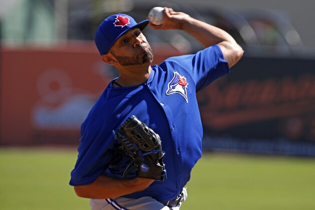 Toronto Blue Jays starting pitcher Ricky Romero throws during an exhibition spring training baseball game against the Toronto Blue Jays in Sarasota, Fla., Saturday, March 1, 2014. (AP Photo/Gene J. Puskar)