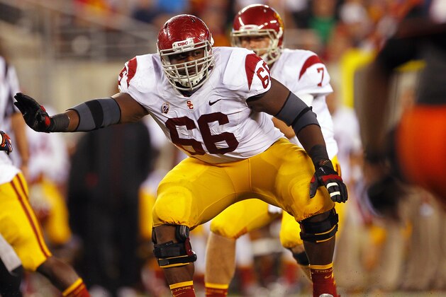 EAST RUTHERFORD, NJ - SEPTEMBER 08:  Marcus Martin #66 of the USC Trojans looks to block against the Syracuse Orange during a game at MetLife Stadium on September 8, 2012 in East Rutherford, New Jersey. (Photo by Rich Schultz/Getty Images)