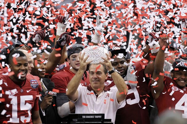 ADVANCE FOR WEEKEND EDITIONS, AUG. 10-11 - FILE - In this Jan. 9, 2012, file photo, Alabama head coach Nick Saban celebrates with his team after defeating LSU 21-0 in the the BCS National Championship college football game in New Orleans. Saban is rapidly gaining on Paul