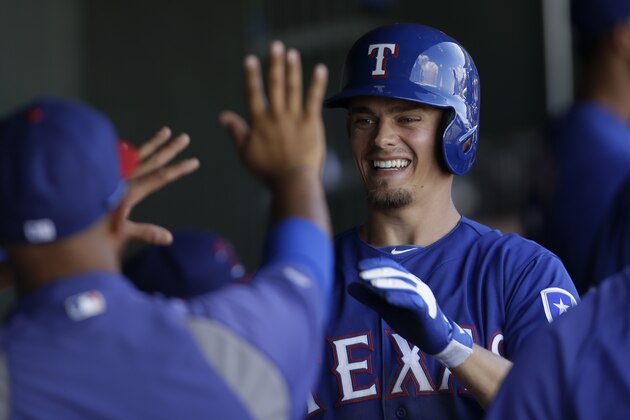 SURPRISE, AZ - FEBRUARY 27: Brent Lillibridge #20 of the Texas Rangers runs the bases after hitting a home run in the top of the seventh inning against the Kansas City Royals at Surprise Stadium on February 27, 2014 in Surprise, Arizona. (Photo by Mike McGinnis/Getty Images)