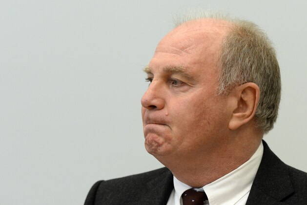 Uli Hoeness,  president of German soccer club Bayern Munich,  waits at the regional court in Munich, southern Germany Thursday March 13, 2014. Hoeness is accused in a tax evasion case that could land the German soccer legend in prison. Bavarian prosecutors filed charges against Hoeness after he reported himself to authorities for having a previously undeclared Swiss bank account. A verdict is expected today.  (AP Photo/Christof Stache,Pool)