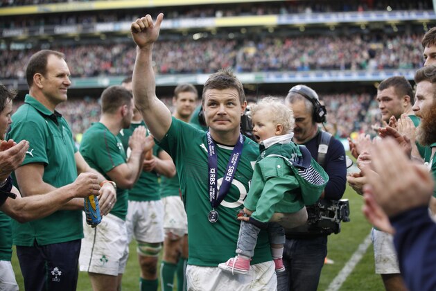 Ireland's Brian O'Driscoll and daughter Sadie leave the pitch after he played his last home game during during their Six Nations Rugby Union match against Italy  at the Aviva Stadium, Dublin, Ireland, Saturday, March 8, 2014.  (AP Photo/Peter Morrison)