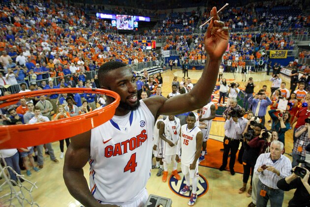 GAINESVILLE, FL - MARCH 08: Patric Young #4 of the Florida Gators holds up a piece of the net after the game against the Kentucky Wildcats at the Stephen C. O'Connell Center on March 8, 2014 in Gainesville, Florida. The Gators were 18-0 in the SEC Conference and undefeated at home this season. (Photo by Rob Foldy/Getty Images)