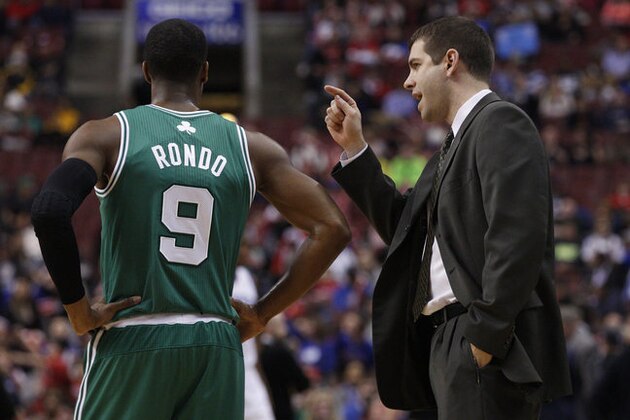 Boston Celtics' head coach Brad Stevens, right, talks wit Rajon Rondo, left, during the first half of an NBA basketball game against the Philadelphia 76ers', Wednesday, Feb. 5, 2014, in Philadelphia. The Celtics won 114-108. (AP Photo/Chris Szagola)
