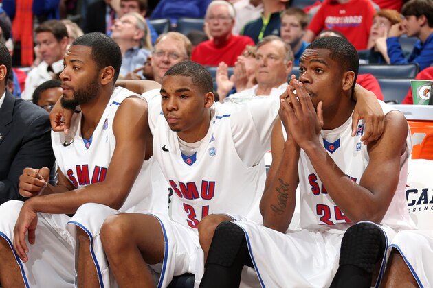 MEMPHIS, TN - MARCH 13: Ben Moore #34 and Yanick Moreira #35 of the SMU Mustangs look on dejected from bench moments before their loss to the Houston Cougars during the quarterfinal round of the American Athletic Conference Tournament at FedExForum on March 13, 2014 in Memphis, Tennessee. Houston defeated SMU 68-64. (Photo by Joe Murphy/Getty Images)