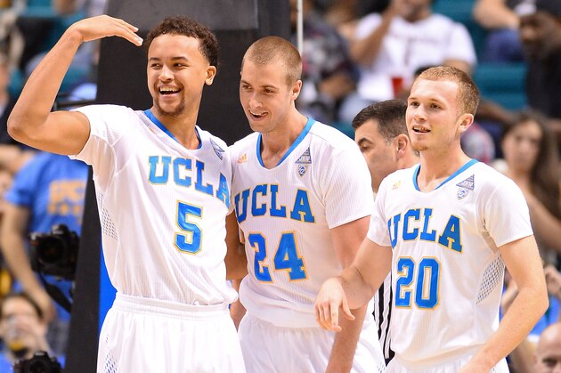 LAS VEGAS, NV - MARCH 13:  Kyle Anderson #5, Travis Wear #24 and Bryce Alford #20 of the UCLA Bruins celebrate on the court late in their quarterfinal game of the Pac-12 Basketball Tournament against the Oregon Ducks at the MGM Grand Garden Arena on March 13, 2014 in Las Vegas, Nevada. UCLA won 82-63.  (Photo by Ethan Miller/Getty Images)