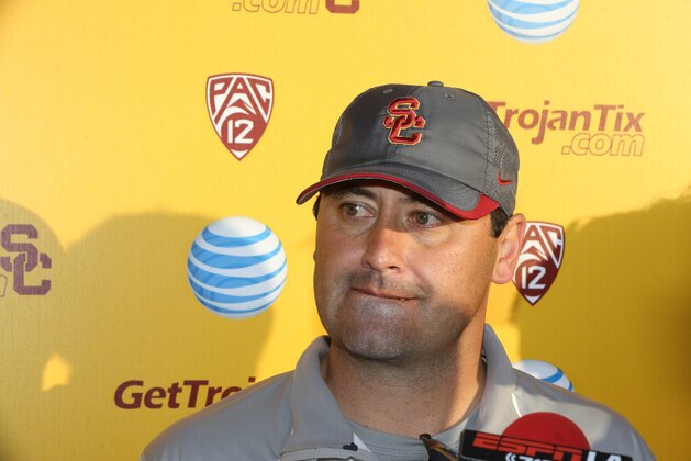 Southern California coach Steve Sarkisian takes questions from members of the media after spring practice for the NCAA college football team in Los Angeles, Thursday, March 13, 2014. (AP Photo/Damian Dovarganes)