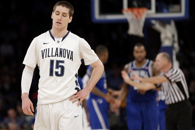 Villanova's Ryan Arcidiacono, left, reacts after his team committed a foul during the second half of an NCAA college basketball game against Seton Hall in the second round of the Big East Conference tournament at Madison Square Garden, Thursday, March 13, 2014 in New York. Seton Hall defeated Villanova 64-63.(AP Photo/Seth Wenig)