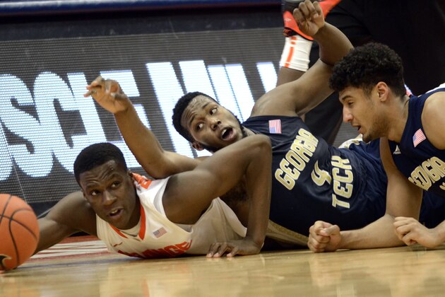 Syracuse's Tyler Roberson, left, battles Georgia Tech's Robert Carter Jr. and Chris Bolden for a loose ball during the second half of an NCAA college basketball game in Syracuse, N.Y., Tuesday, March 4, 2014. Georgia Tech won 67-62. (AP Photo/Kevin Rivoli) Syracuse's Tyler Roberson, left, battles Georgia Tech's Robert Carter Jr. and Chris Bolden for a loose ball during the second half of an NCAA college basketball game in Syracuse, N.Y., Tuesday, March 4, 2014. Georgia Tech won 67-62. (AP Photo/Kevin Rivoli)