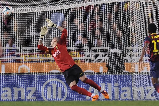 FC Barcelona's goalkeeper Victor Valdes fails to block the goal while his teammate Alex Song of Cameroon, looks on, during their Spanish League soccer match, at Anoeta stadium in San Sebastian, Spain, Saturday, Feb. 22, 2014. FC Barcelona lost the match 3-1. (AP Photo/Alvaro Barrientos) FC Barcelona's goalkeeper Victor Valdes fails to block the goal while his teammate Alex Song of Cameroon, looks on, during their Spanish League soccer match, at Anoeta stadium in San Sebastian, Spain, Saturday, Feb. 22, 2014. FC Barcelona lost the match 3-1. (AP Photo/Alvaro Barrientos)