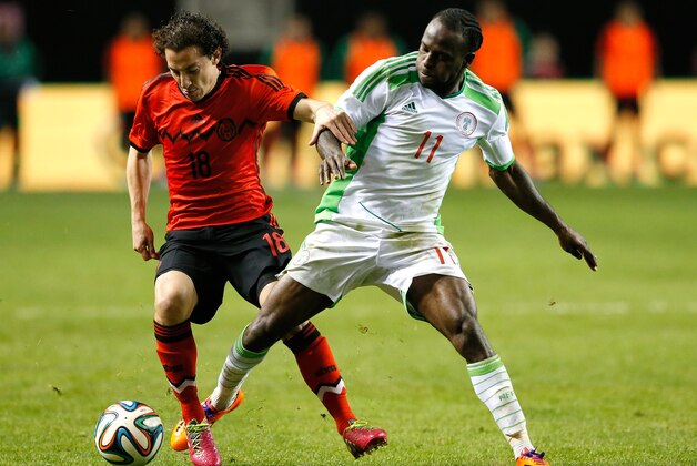 ATLANTA, GA - MARCH 05:  Andres Guardado #18 of Mexico battles for the ball against Victor Moses #11 of Nigeria at Georgia Dome on March 5, 2014 in Atlanta, Georgia.  (Photo by Kevin C. Cox/Getty Images)