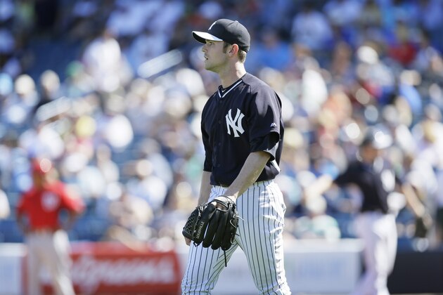 New York Yankees relief pitcher David Robertson walks on the field during the fourth inning of an exhibition baseball game against the Washington Nationals Monday, March 3, 2014, in Tampa, Fla. (AP Photo/Charlie Neibergall)