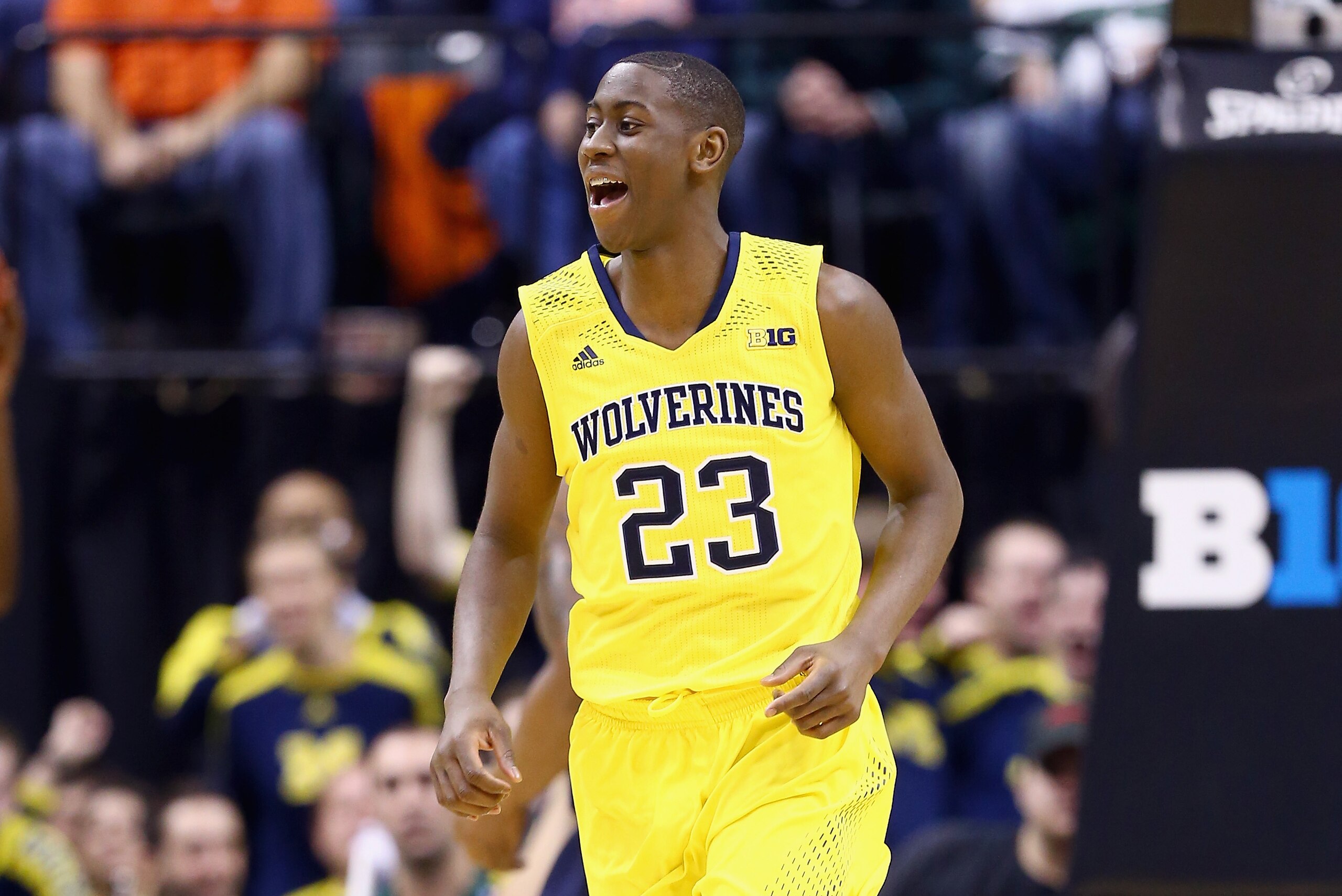 INDIANAPOLIS, IN - MARCH 14:  Caris LeVert #23 of the Michigan Wolverines celebrates in the game against the Illinois Fighting Illini during the Quarterfinals of the Big Ten Basketball Tournament at Bankers Life Fieldhouse on March 14, 2014 in Indianapolis, Indiana.  (Photo by Andy Lyons/Getty Images)