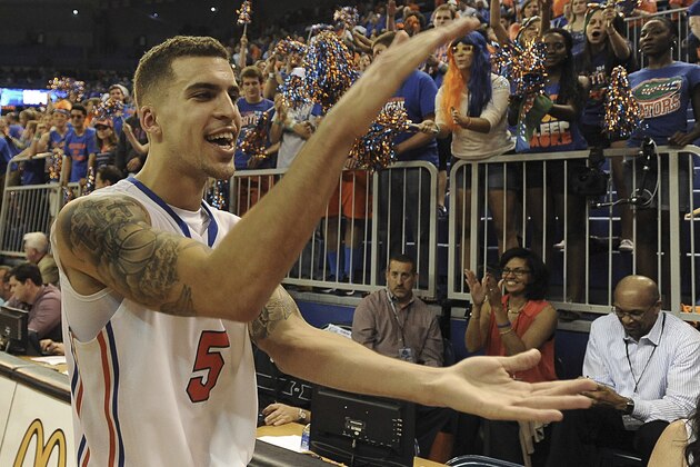 Florida guard Scottie Wilbekin (5) does the gator chomp as he leaves the court after Florida defeated LSU 79-61 in an NCAA college basketball game Saturday, March 1, 2014 in Gainesville, Fla.  (AP Photo/Phil Sandlin)