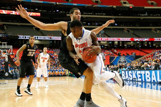 ATLANTA, GA - MARCH 14:  Keanau Post #45 of the Missouri Tigers defends against Casey Prather #24 of the Florida Gators during the quarterfinals of the SEC Men's Basketball Tournament at Georgia Dome on March 14, 2014 in Atlanta, Georgia.  (Photo by Kevin C. Cox/Getty Images)