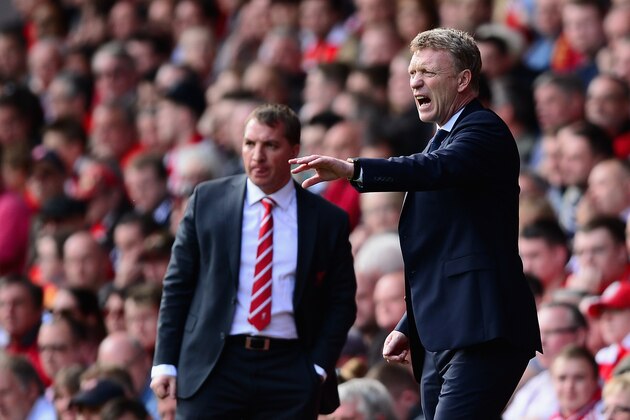 LIVERPOOL, ENGLAND - MAY 05:  Everton Manager David Moyes gestures as Liverpool Manager Brendan Rodgers looks on during the Barclays Premier League match between Liverpool and Everton at Anfield on May 5, 2013 in Liverpool, England.  (Photo by Laurence Griffiths/Getty Images)