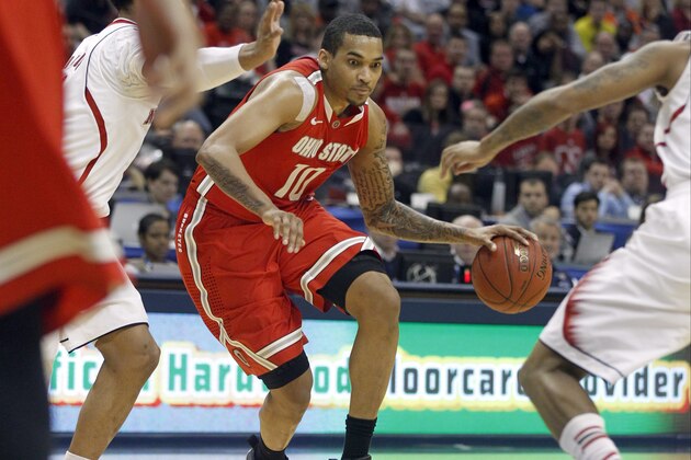 Ohio State forward LaQuinton Ross (10) drives the ball against the Nebraska defense in the second half of an NCAA college basketball game in the quarterfinals of the Big Ten Conference tournament on Friday, March 14, 2014, in Indianapolis. Ohio State won 71-67. (AP Photo/Kiichiro Sato)