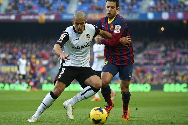 BARCELONA, SPAIN - FEBRUARY 01:   Jordi Alba (R) of FC Barcelona competes for the ball with Sofiane Feghouli of Valencia CF during the La Liga match between FC Barcelona and Valencia CF at Camp Nou on February 1, 2014 in Barcelona, Spain.  (Photo by Manuel Queimadelos Alonso/Getty Images)