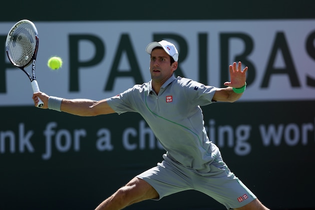 INDIAN WELLS, CA - MARCH 14: Novak Djokovic of Serbia lunges to return a forehand to Julien Benneteau of France during the BNP Paribas Open at Indian Wells Tennis Garden on March 14, 2014 in Indian Wells, California. (Photo by Jeff Gross/Getty Images) INDIAN WELLS, CA - MARCH 14: Novak Djokovic of Serbia lunges to return a forehand to Julien Benneteau of France during the BNP Paribas Open at Indian Wells Tennis Garden on March 14, 2014 in Indian Wells, California. (Photo by Jeff Gross/Getty Images)