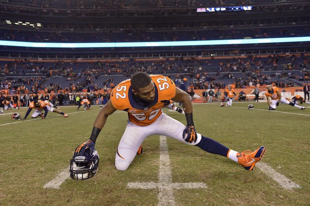Denver Broncos middle linebacker Wesley Woodyard (52) stretches before playing against the San Diego Chargers in an NFL football game, Thursday, Dec. 12, 2013, in Denver. (AP Photo/Jack Dempsey)