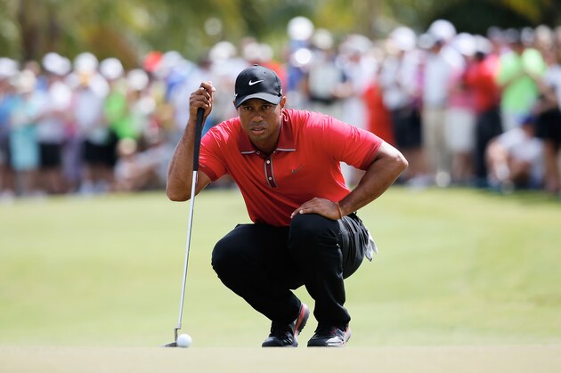 DORAL, FL - MARCH 09:  Tiger Woods lines up a putt on the first green during the final round of the World Golf Championships-Cadillac Championship at Trump National Doral on March 9, 2014 in Doral, Florida.  (Photo by Chris Trotman/Getty Images)