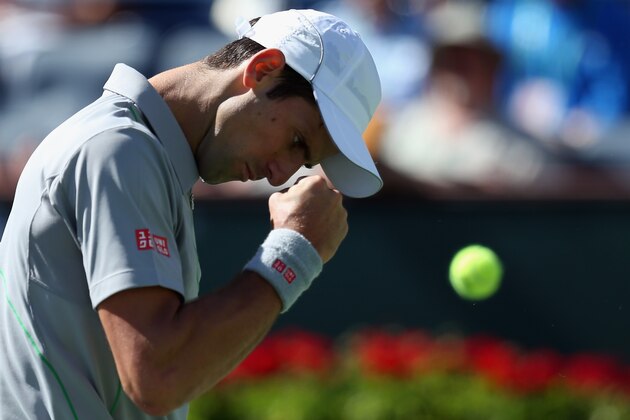 INDIAN WELLS, CA - MARCH 14:  Novak Djokovic of Serbia reacts after winning a point against Julien Benneteau of France during the BNP Paribas Open at Indian Wells Tennis Garden on March 14, 2014 in Indian Wells, California.  (Photo by Jeff Gross/Getty Images)
