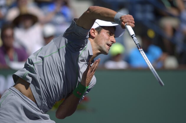 Novak Djokovic, of Serbia, serves to Julien Benneteau, of France, in their quarterfinal match at the BNP Paribas Open tennis tournament, Friday, March 14, 2014, in Indian Wells, Calif. (AP Photo/Mark J. Terrill) Novak Djokovic, of Serbia, serves to Julien Benneteau, of France, in their quarterfinal match at the BNP Paribas Open tennis tournament, Friday, March 14, 2014, in Indian Wells, Calif. (AP Photo/Mark J. Terrill)