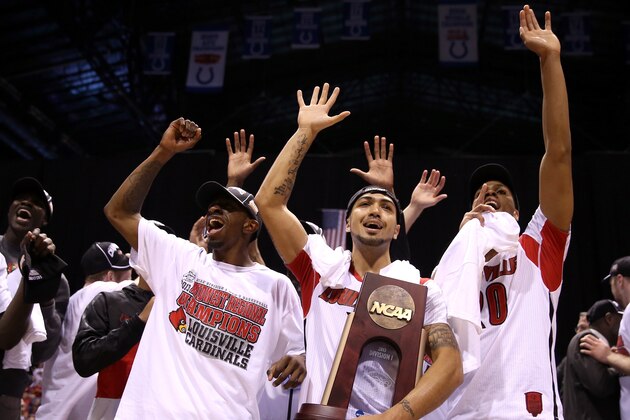 INDIANAPOLIS, IN - MARCH 31:  (L-R) Russ Smith #2 , Peyton Siva #3 and Wayne Blackshear #20 of the Louisville Cardinals celebrate with the Midwest Regional Championship trophy after they won 85-63 against the Duke Blue Devils during the Midwest Regional Final round of the 2013 NCAA Men's Basketball Tournament at Lucas Oil Stadium on March 31, 2013 in Indianapolis, Indiana.  (Photo by Andy Lyons/Getty Images)