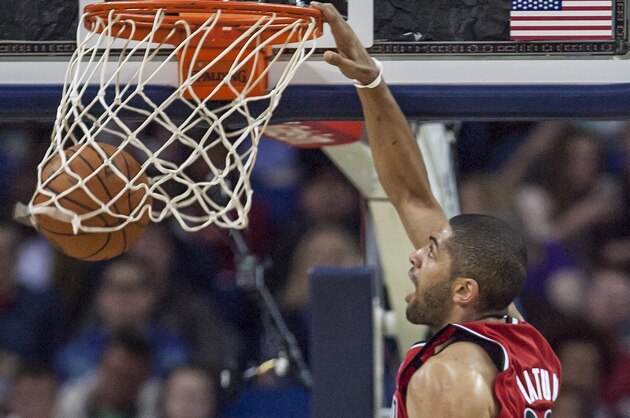 Portland Trail Blazers forward Nicolas Batum (88) dunks against against the New Orleans Pelicans in the second half of an NBA basketball game in New Orleans, Friday, March 14, 2014. The Trail Blazers won 111-103. (AP Photo/Scott Threlkeld)