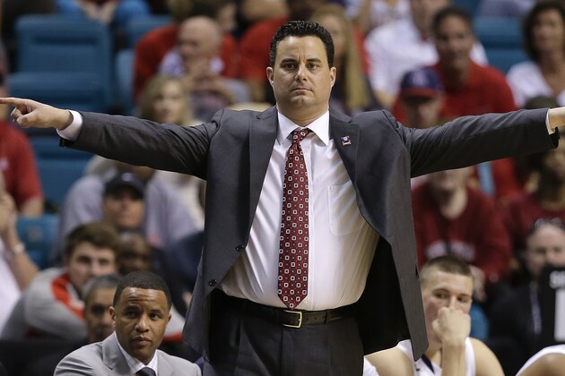 Arizona coach Sean Miller motions to players in the second half against Colorado during the second half of an NCAA college basketball game in the semifinals of the Pac-12 Conference on Friday, March 14, 2014, in Las Vegas. Arizona won 63-43. (AP Photo/Julie Jacobson)