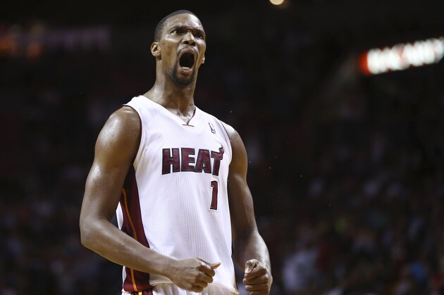 Miami Heat's Chris Bosh reacts after LeBron James scored a three point shot during the second half of an NBA basketball game in Miami, Monday, March 10, 2014 against the Washington Wizards. The Heat won 99-90. (AP Photo/J Pat Carter) Miami Heat's Chris Bosh reacts after LeBron James scored a three point shot during the second half of an NBA basketball game in Miami, Monday, March 10, 2014 against the Washington Wizards. The Heat won 99-90. (AP Photo/J Pat Carter)