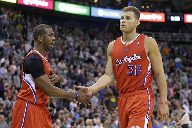 Los Angeles Clippers' Chris Paul, left, congratulates teammate Blake Griffin (32) in the second half during an NBA basketball game against the Utah Jazz, Friday, March 14, 2014, in Salt Lake City. The Clippers won 96-87. (AP Photo/Rick Bowmer)
